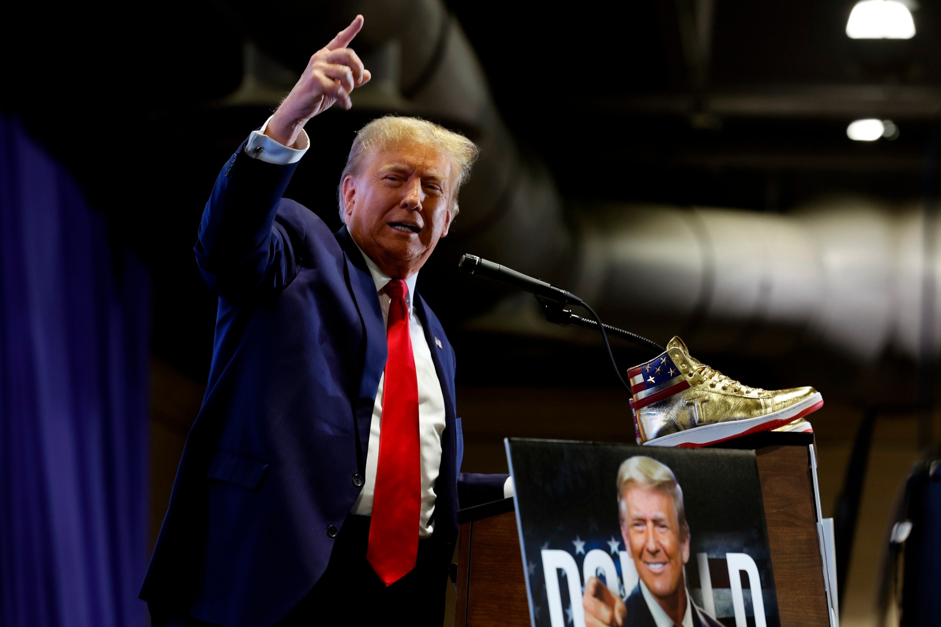 PHOTO: Republican presidential candidate and former President Donald Trump takes the stage to introduce a new line of exclusive shoes at Sneaker Con at the Philadelphia Convention Center, February 17, 2024, in Philadelphia.