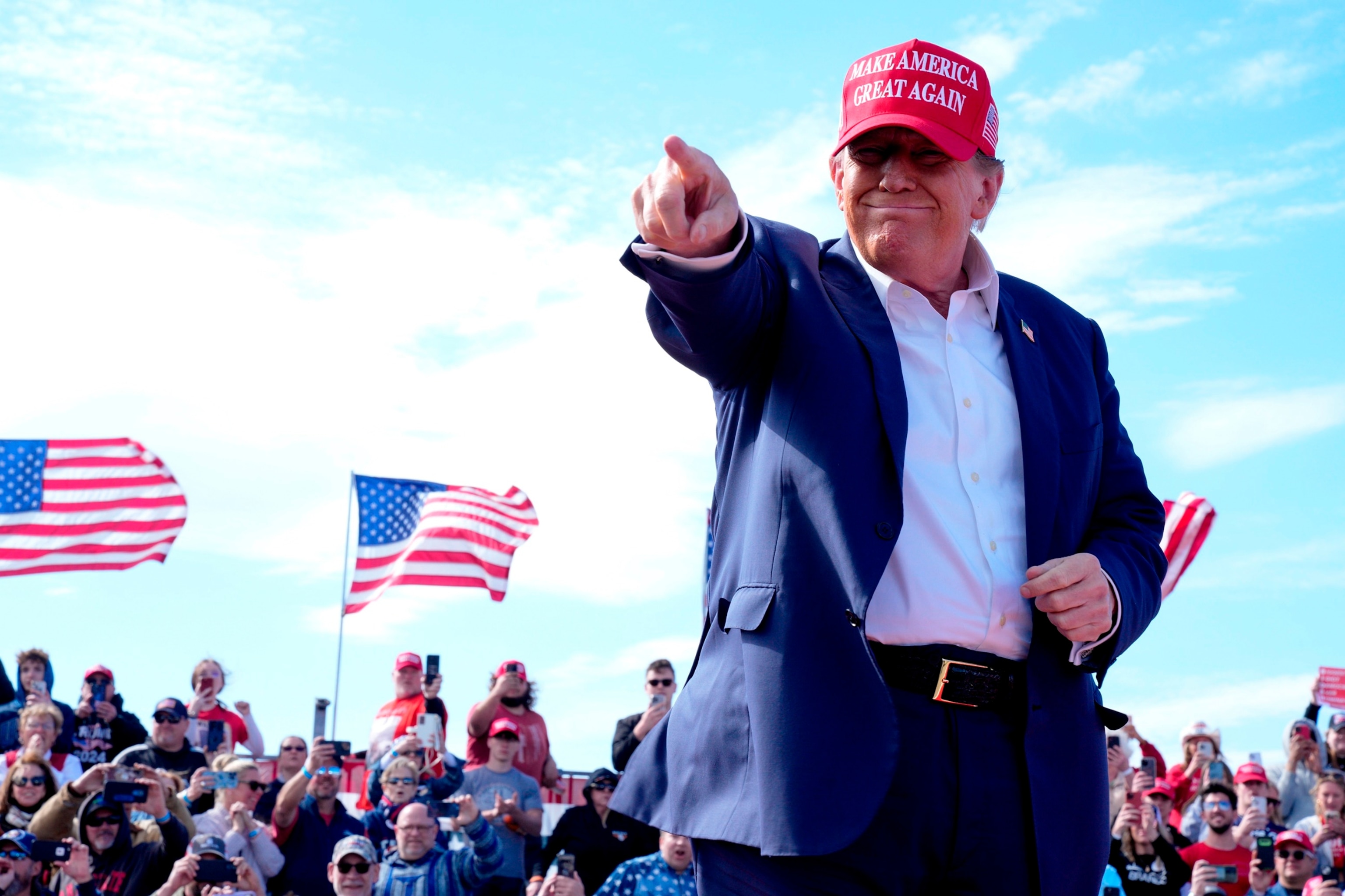 PHOTO: Former Republican President Donald Trump gestures to the crowd at a campaign rally, March 16, 2024, in Vandalia, Ohio.