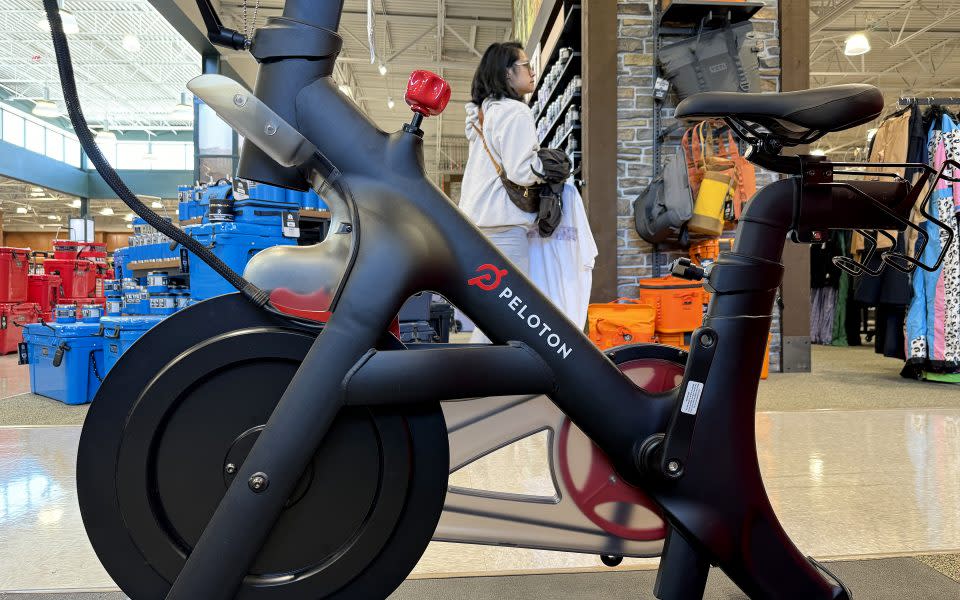 DALY CITY, CALIFORNIA - MAY 08: A Peloton bike is displayed at a Dick's Sporting Goods store on May 08, 2024 in Daly City, California. Several private equity firms are considering a takeover of struggling fitness company Peloton a week after CEO Barry McCarthy announced he would step down and the company planned to cut 15% of its workforce following a poor earnings report. The company has had 13 consecutive quarters of financial losses. (Photo by Justin Sullivan/Getty Images)